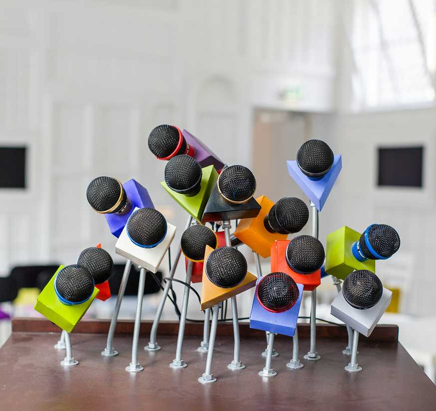 Dedicated preschool teacher reading an engaging storybook to a group of attentive children during Creative Curriculum time at Quokka Kids